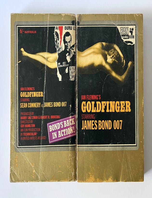 Item #76145 Goldfinger. UK Film tie-in editions [two variant copies of the same impression]. Ian Lancaster FLEMING.